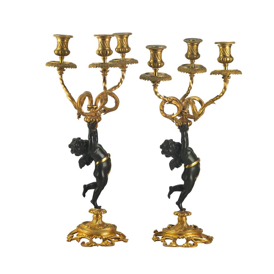 Pair French Patinated and Gilt Bronze Figural Three Light Candelabra, early 20th century